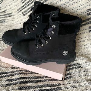 Black Timberlands with suede tops and laces